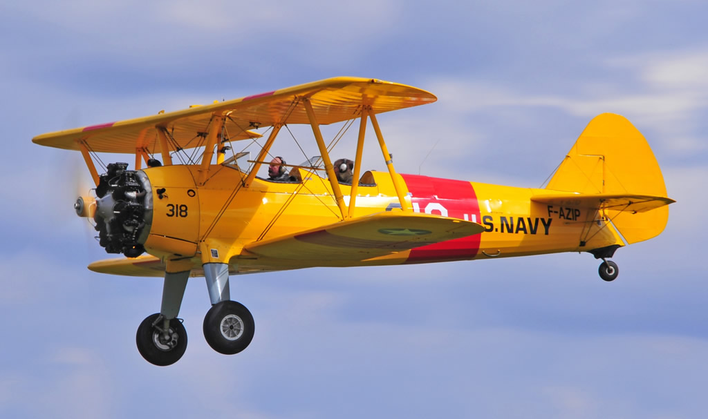 U.S. Navy Stearman with yellow wings, fuselage and tail surfaces ... seen here is F-AZIP